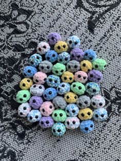 there is a pile of small crocheted skulls