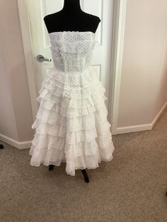 This beautiful 1950s strapless Suzy Perette white cotton eyelet tiered Party iconic I.Magnin designer dress comes to you in a size XS-S. As you can see from the pictures absolutely beautiful dress. Makes a great rockabilly dress - pls compare the measurements I give you to those in your closet. What a find. measurements are 16 inches underarm to underarm-12 inches across waist-38 1/2 inches underarm to bottom of dress- 1950s White Cotton Dress, Camano Island, Strapless Party Dress, Rockabilly Dress, Designer Dress, White Eyelet, Vintage Dress, Dress Clothes For Women, Vintage 1950s