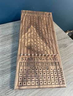 a wooden game board sitting on top of a table