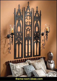 an ornate iron headboard with candles on it