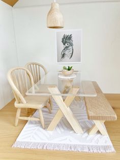 a glass table with two chairs and a bench