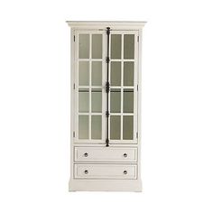 a white cabinet with glass doors on the front and drawers in the bottom, against a white background