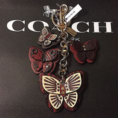 Coach - Butterfly Cluster Charm/ Keychain (Nwt) New. Unused With Tags Color: Gold / Wine Multi 100% Leather Smooth Leather And Snake-Embossed Leather This Butterfly Cluster Charm / Keychain By Coach Is Absolutely Stunning! Please Note: Coach Bag Not Included Smoke & Pet Free Environment Coach Butterfly, Gold Wine, Coin Purse Keychain, Coach Floral, Luxury Bags Collection, Black Gold Ring, Leather Keyring, Bag Charms, Charm Keychain