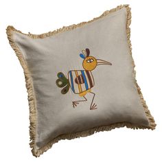 an embroidered pillow with a bird on it