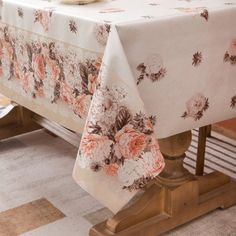 a table with a flowered cloth on it