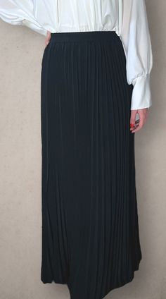 Modest high rise maxi skirt. Elastic waistband. Pleated. Fully lined for full coverage. Chic Stretch Maxi Skirt, Long Skirt With Elastic Waistband For Night Out, Elastic Long Skirt For Night Out, Chic Long Pleated Skirt With Elastic Waistband, Formal Lined Maxi Skirt For Spring, Formal High Waist Flowy Maxi Skirt, Chic Black Maxi Dress With Elastic Waistband, Flowy Maxi Skirt For Night Out, Black Full-length Maxi Skirt For Work