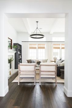 a living room filled with furniture and a fire place