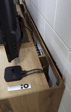 a computer monitor sitting on top of a wooden desk