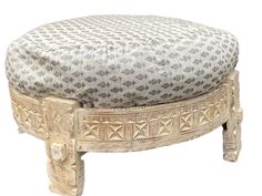 the ottoman is made from wood and has a patterned cover on it's top