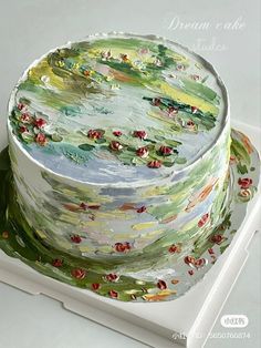 the cake is decorated with water lilies