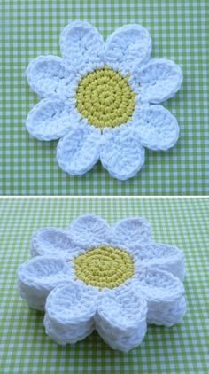 crocheted daisy coasters are shown in two different colors and sizes, one is white with yellow center