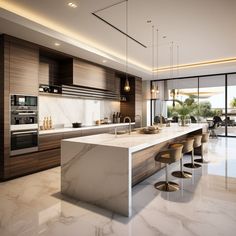 a modern kitchen with marble counter tops and bar stools