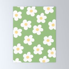 a green and white flower pattern with yellow centers on the petals canvas wall art print