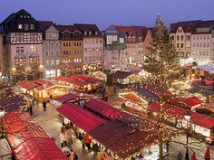 the christmas market is lit up and ready for everyone to enjoy it's holiday season