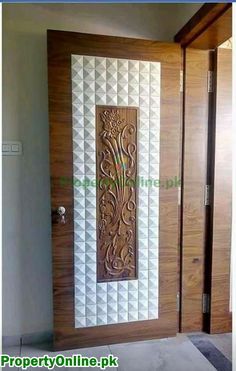 a wooden door with an intricate design on the front and side panels inlays