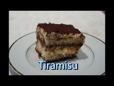 a piece of cake on a plate with the word tiamisu in front of it