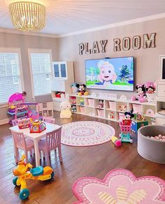 a child's play room with mickey mouse rugs and toys