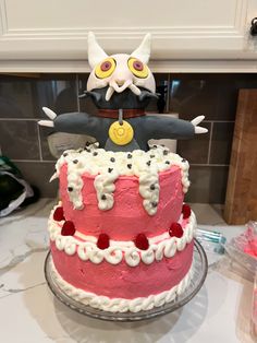 a cat cake sitting on top of a counter