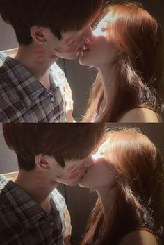 two people kissing each other in front of a mirror with their faces close to the camera