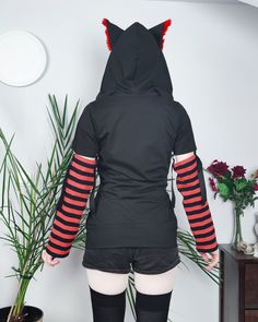 "𝘾𝘼𝙏 𝙀𝘼𝙍𝙎 𝙃𝙊𝙊𝘿𝙄𝙀 - 𝙍𝙀𝘿 - 𝙈𝘼𝙇𝙀 / 𝙁𝙀𝙈𝘼𝙇𝙀 𝘾𝙐𝙏 Black cat hoodie with ears. This cat ear hoodie has red fur inside the standing cat ears. 𝗪𝗛𝗔𝗧 𝗪𝗜𝗟𝗟 𝗜 𝗥𝗘𝗖𝗘𝗜𝗩𝗘？ ♥ Zip up hoodie ♥ Hood with cat ears (fur inside) ♥ Detachable sleeves (easy to apply!) ♥ Sleeves with thumbholes ♥ Big pockets to hold your stuff :D 𝗙𝗔𝗕𝗥𝗜𝗖: Cotton sweatshirt, faux fur for the ears 𝗦𝗜𝗭𝗘: Male or female cut. Size chart you will find it on the last photo! For custom size pic Harajuku Style Hoodie For Winter Cosplay, Harajuku Style Hoodie For Cosplay In Winter, Red Hoodie For Cosplay In Winter, Red Long Sleeve Hoodie For Cosplay, Harajuku Style Hooded Halloween Hoodie, Harajuku Halloween Hoodie, Harajuku Style Halloween Hoodie, Cosplay Hooded Sweatshirt With Drawstring, Halloween Cosplay Hoodie