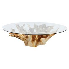 a glass and wood table with an animal head on the top, in front of a white background