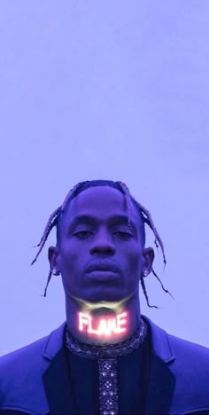 a man with dreadlocks wearing a neon sign on his neck