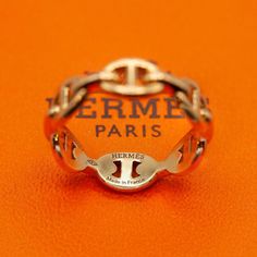 Preowned HERMES Ring from the Chain d' Ancre Enchainee collection in 18K yellow gold  Ring comes in original HERMES ring box as shown in photo  Ring Size: 50 (US 5.25)  Approximate Gross Weight: 3.8gm  Approximate Measurement: 5.63mm band  Hallmarks: Hermes, Made in France, Au750, 50, 19G 105057  Retail: ~ $2550 Hermes Ring Gold, Hermes Rings, Hermes Ring, Photo Ring, Hermes Jewelry, Hermes Accessories, Hermes Box, 18k Yellow Gold Ring, Yellow Gold Ring