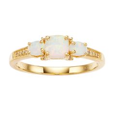 Three lab-created opals make this 18k gold ring an accessory you have to have. Three lab-created opals make this 18k gold ring an accessory you have to have. RING DETAILS Width: 5 mm Plating: 18k gold Metal: sterling silver Nickel free Packaging: boxed STONE DETAILS Stone Types: lab-created opal & diamond accents Center stone type: 5 mm x 5 mm Cut: cushion Gift Givers: This item ships in its original packaging. If intended as a gift, the packaging may reveal the contents. Diamond equivalent Elegant Gold Opal Ring With Three Stones, Gold Opal Three-stone Oval Ring, Gold Oval Three-stone Opal Ring, Gold Oval Three Stone Opal Ring, Gold Oval Opal Ring With Three Stones, Stone Types, Diamond Accent Ring, 3 Stone Rings, Right Hand Rings