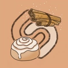 a cinnamon roll with icing next to some cinnamon sticks