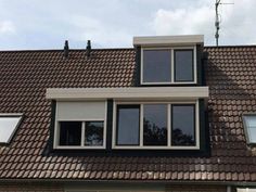 the roof of a house with two windows