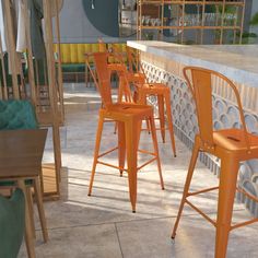 an outdoor bar with orange chairs and barstools