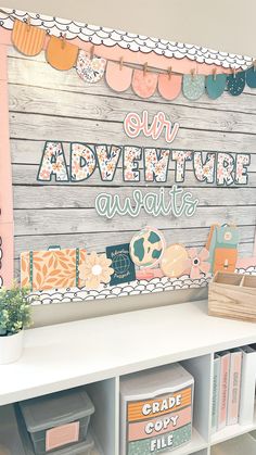 a sign that says our adventure awaits on the side of a wooden wall with bookshelves