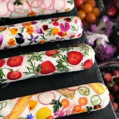 four different types of fruit and veggies on display