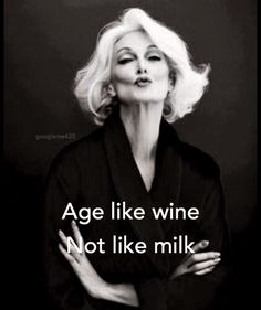 a woman with her arms crossed and the words age like wine not like milk