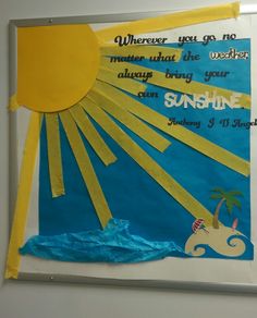 a bulletin board with sun and palm tree on it