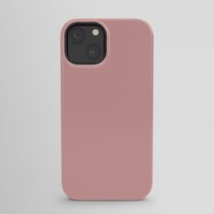 a pink iphone case sitting on top of a white surface