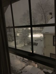 snow is falling outside the window and it looks like they're going to fall