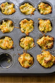 a muffin tin filled with several different types of food