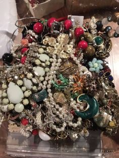 a pile of jewelry sitting on top of a table