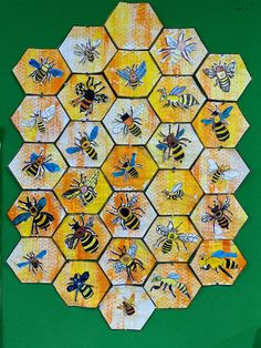 a bunch of bees that are sitting on some tiles in the shape of hexagons