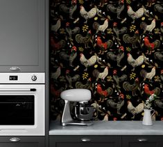 a wallpaper with roosters and flowers on it in a kitchen area next to an oven