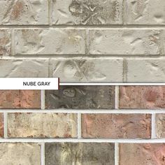 a brick wall with the name nubie gray on it