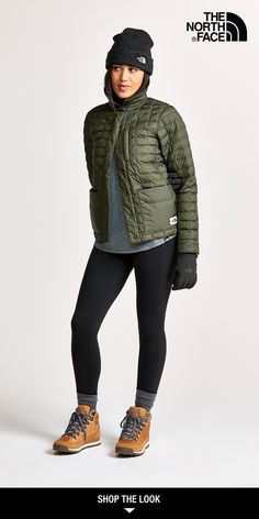 the north face women's down filled jacket is shown in olive green and black