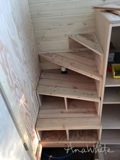 the shelves are made out of wood and have been placed on top of each other