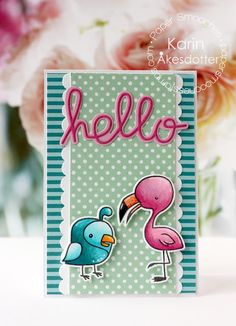 a card with a pink flamingo and blue bird on it