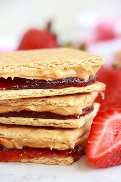 three peanut butter and jelly graham cracker sandwiches in a pile. Graham Cracker Sandwich, Bread Sandwich, Finger Sandwiches, Popular Snacks, No Bake Snacks, Easy Peanut Butter