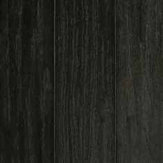 a close up view of the wood grains on this dark colored flooring material