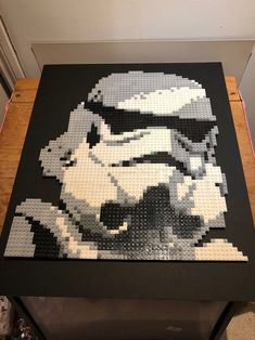 a lego star wars stormtrooper is displayed on a table