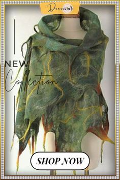 a green and yellow scarf on display with the words new collection written in gold lettering