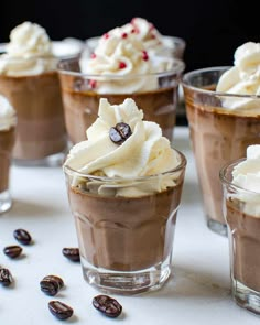 chocolate desserts with whipped cream and coffee beans